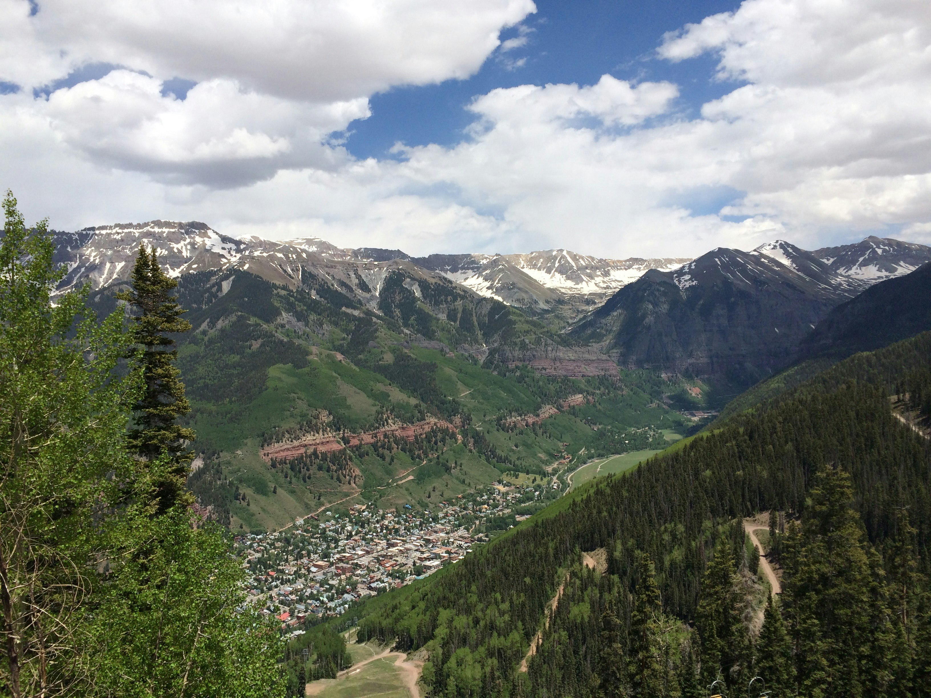 aerial photograph of city between mountains